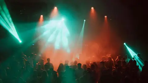 Crowd dancing under lights