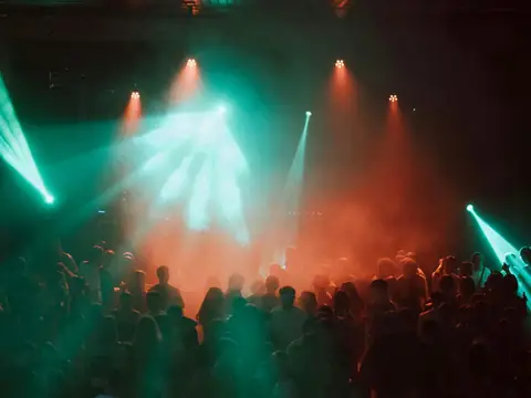 Crowd dancing under lights