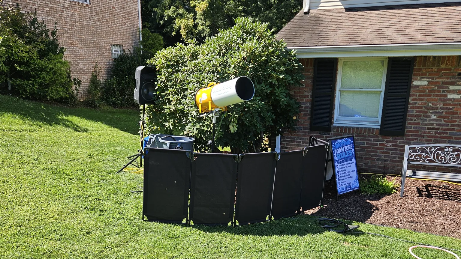 BigTime Foam cannon, speaker, safety barrier, and rules sign set up at a real event